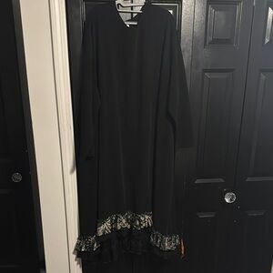 Elegant Black Dress with Floral Hem